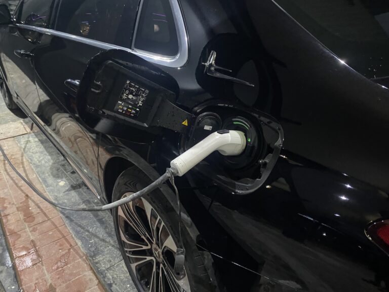 Charging cable connected to an electric vehicle in Abuja