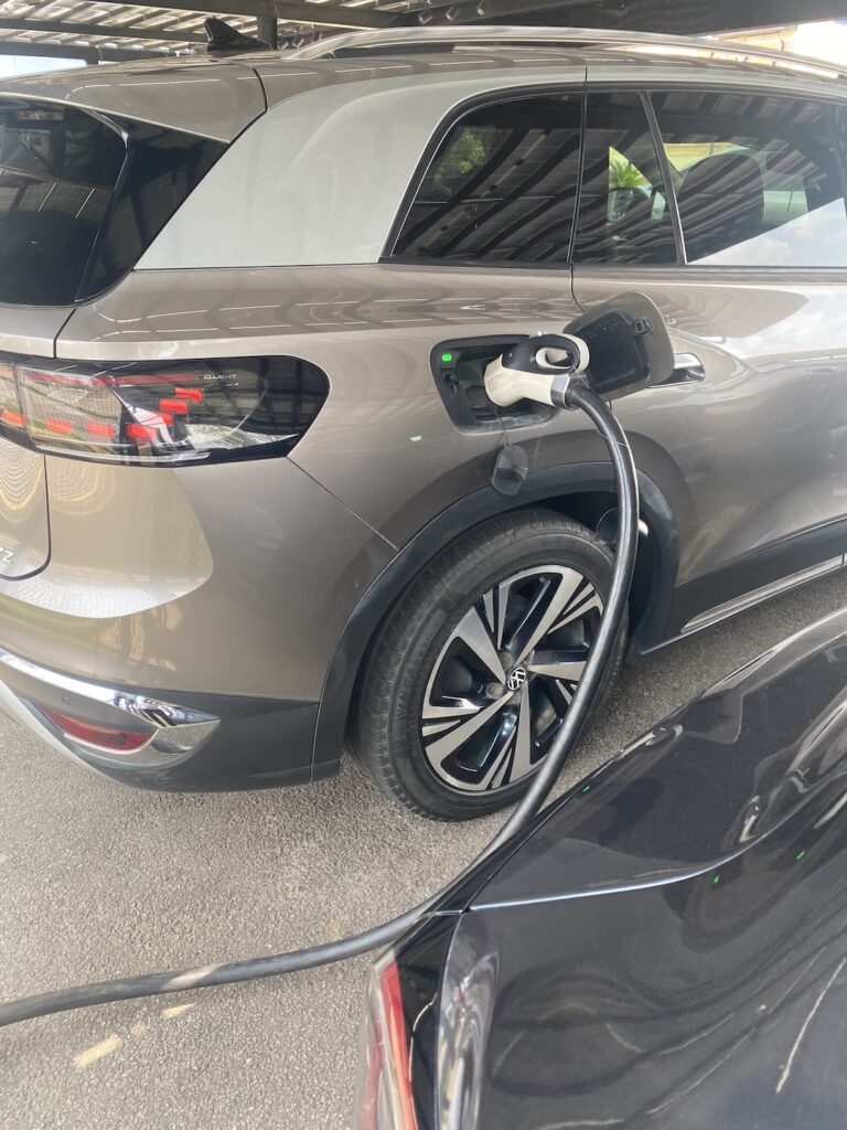 Electric SUV plugged into an EV charge point in Abuja