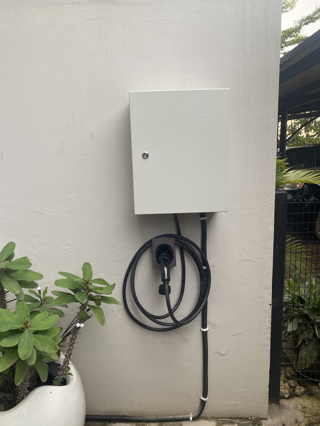 Wall-mounted EV charge point installed by PlugPoint EV Abuja