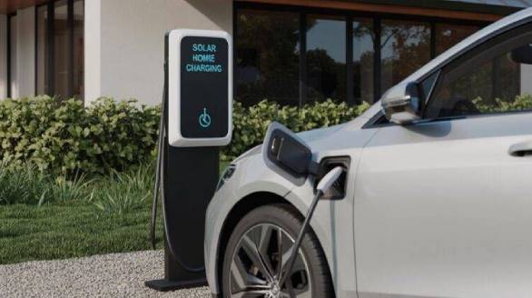 Electric vehicle charging at an EV charge point in Abuja
